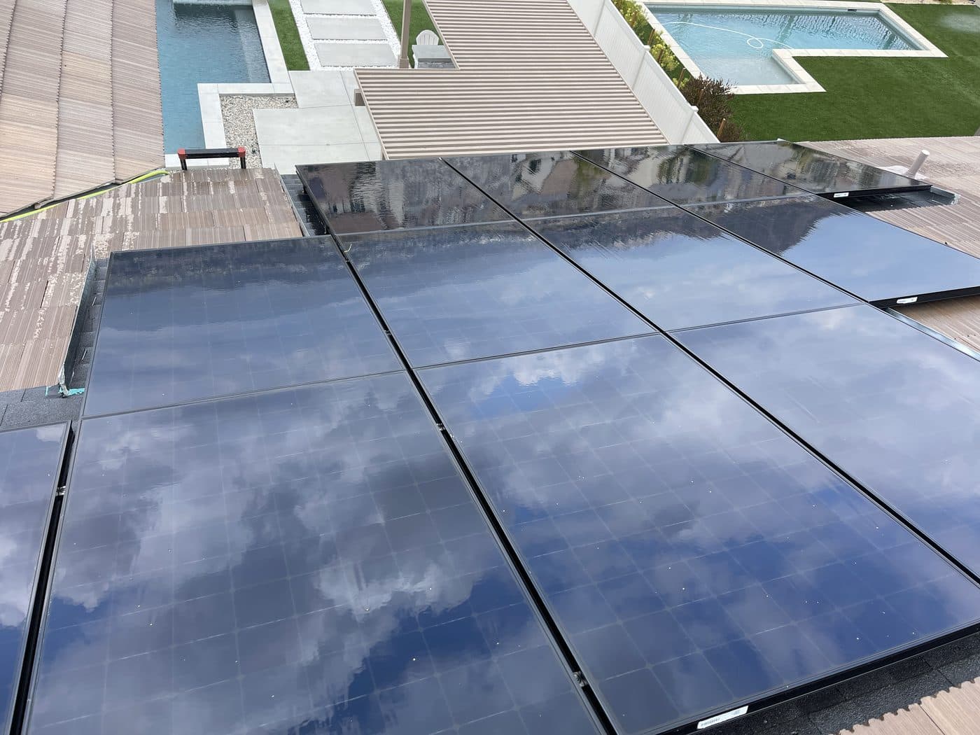 Clean solar panels reflecting the sky after cleaning by Window Wizards